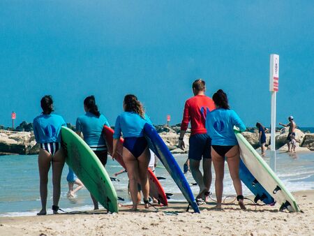 Tel Aviv Israel June 2, 2019 View of unknown Israeli people having fun on the beach of Tel Aviv in the afternoonの写真素材