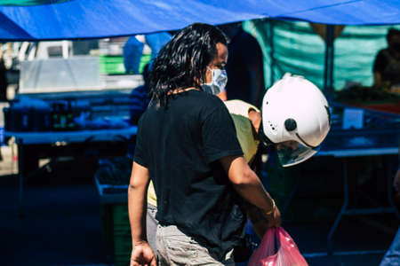Limassol Cyprus June 13, 2020 Portrait of unidentified people with a face mask to protect themselves from the coronavirus shopping at the Limassol market in the morningのeditorial素材