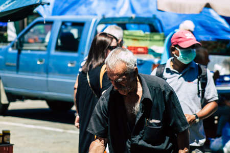 Limassol Cyprus June 13, 2020 Portrait of unidentified people with a face mask to protect themselves from the coronavirus shopping at the Limassol market in the morningのeditorial素材