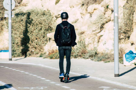 Tel Aviv Israel December 22, 2019 View of unidentified people rolling with a electric scooter in the streets of Tel Aviv in the afternoonのeditorial素材