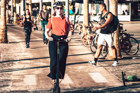 Tel Aviv Israel October 03, 2019 View of unknown Israeli people rolling with a electric scooter in the streets of Tel Aviv in the afternoonのeditorial素材