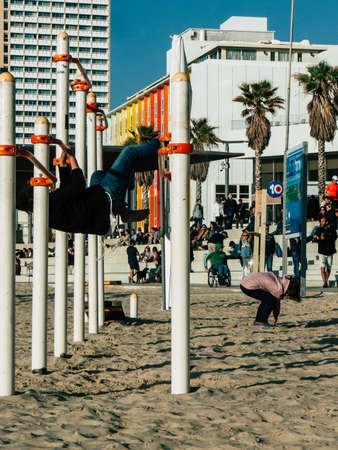 Tel Aviv Israel February 9, 2019 View of unknowns Israeli kids playing on the beach of Tel Aviv in the afternoonのeditorial素材
