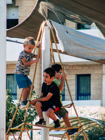 Jerusalem Israel September 11, 2018  View of Israeli kids playing with a bicycle in the street of Jerusalem in the afternoonのeditorial素材