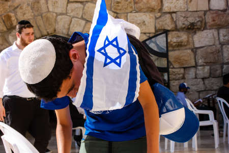 Jerusalem Israel May 14, 2018 Unknowns kids praying front the Western wall in the old city of...