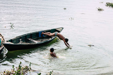 Pokhara Nepal September 29, 2018 View of unknowns Nepali kids playing in the Phewa lake in the afternoonのeditorial素材