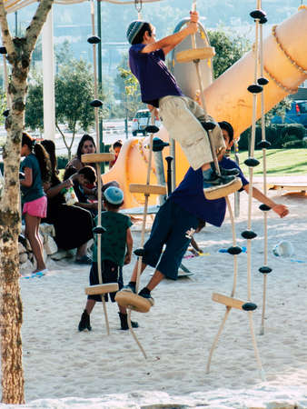 Jerusalem Israel September 11, 2018 View of kids playing in a public garden in Jerusalem in the afternoonのeditorial素材