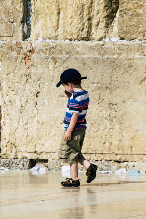 Jerusalem Israel June 19, 2019 View of young Israeli kid walking front the Western wall in the Old city of Jerusalem in the afternoonのeditorial素材