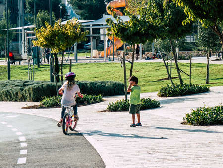 Jerusalem Israel September 11, 2018  View of Israeli kids playing with a bicycle in the street of Jerusalem in the afternoonのeditorial素材