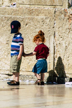 Jerusalem Israel June 19, 2019 View of young Israeli kid walking front the Western wall in the Old city of Jerusalem in the afternoonのeditorial素材