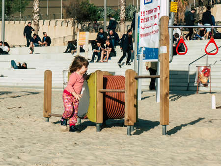Tel Aviv Israel February 9, 2019 View of unknowns Israeli kids playing on the beach of Tel Aviv in the afternoonのeditorial素材