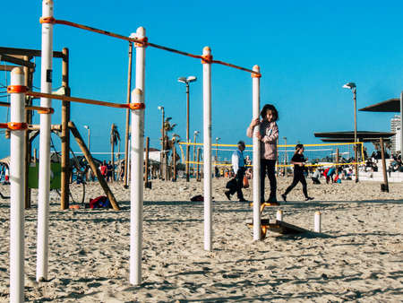 Tel Aviv Israel February 9, 2019 View of unknowns Israeli kids playing on the beach of Tel Aviv in the afternoonのeditorial素材