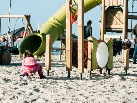 Tel Aviv Israel February 9, 2019 View of unknowns Israeli kids playing on the beach of Tel Aviv in the afternoonのeditorial素材