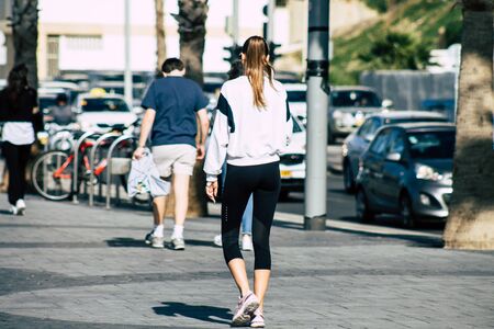 Tel Aviv Israel December 31, 2019 View of unidentified people walking on Herbert Samuel Promenade in Tel Aviv in the afternoonの写真素材