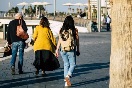 Tel Aviv Israel December 22, 2019 View of unidentified people walking on Herbert Samuel Promenade in Tel Aviv in the afternoonの写真素材