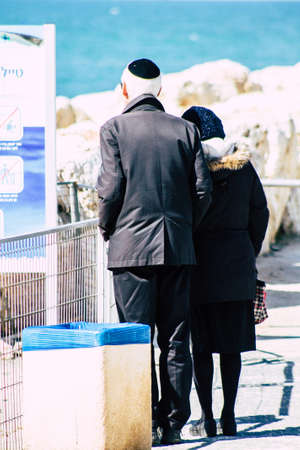 Tel Aviv Israel February 13, 2020 View of unidentified people walking on Herbert Samuel Promenade in Tel Aviv during a sunny day in winterのeditorial素材