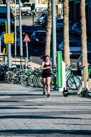 Tel Aviv Israel February 13, 2020 View of unidentified people walking on Herbert Samuel Promenade in Tel Aviv during a sunny day in winterのeditorial素材