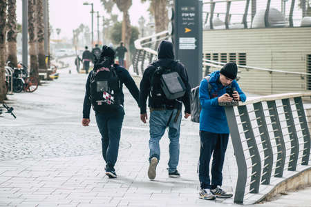 Tel Aviv Israel December 25, 2019 View of unidentified people walking on Herbert Samuel Promenade in Tel Aviv in the afternoonのeditorial素材