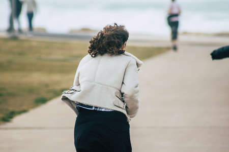 Tel Aviv Israel December 25, 2019 View of unidentified people walking on Herbert Samuel Promenade in Tel Aviv in the afternoonのeditorial素材