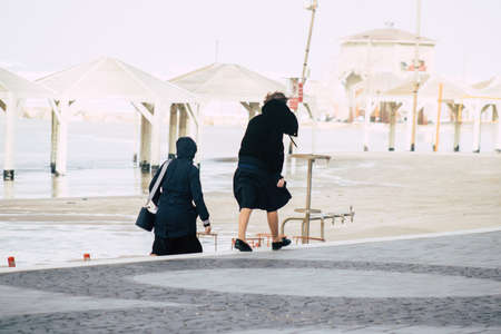 Tel Aviv Israel December 25, 2019 View of unidentified people walking on Herbert Samuel Promenade in Tel Aviv in the afternoonのeditorial素材