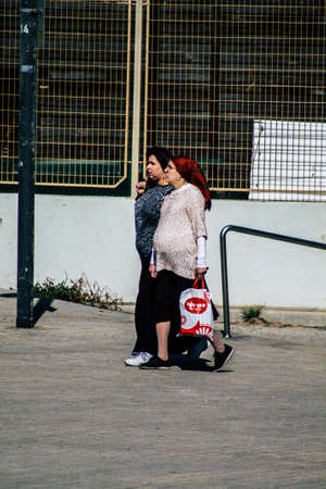 Tel Aviv Israel February 13, 2020 View of unidentified people walking on Herbert Samuel Promenade in Tel Aviv during a sunny day in winterのeditorial素材