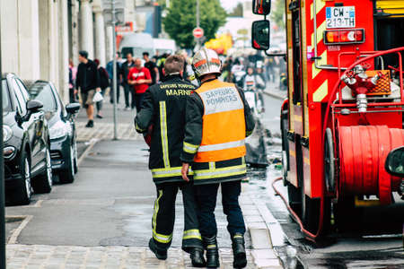 Reims France May 18, 2019 View of firefighters extinguishing a construction hut burned by rioters...