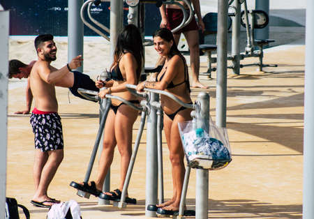 Tel Aviv Israel July 23, 2019 View of unknown Israeli people having fun on the beach of Tel Aviv during a sunny day in the afternoonのeditorial素材