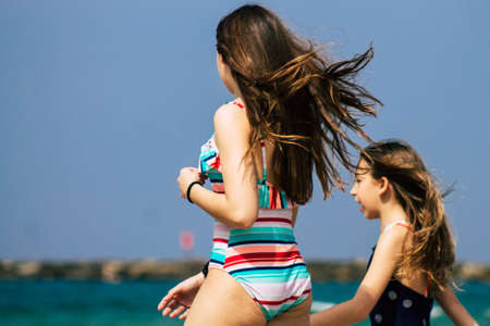 Tel Aviv Israel July 15, 2019 View of unknown child having fun on the beach of Tel Aviv during a sunny day in the afternoonのeditorial素材