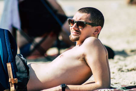Tel Aviv Israel August 20, 2019 View of unknown Israeli people having fun on the beach of Tel Aviv during a sunny day in the afternoonのeditorial素材