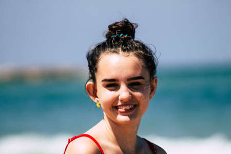Tel Aviv Israel July 6, 2019 View of unknown teen having fun on the beach of Tel Aviv during a sunny day in the afternoonのeditorial素材