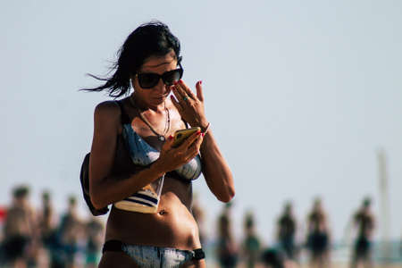 Tel Aviv Israel July 15, 2019 View of unknown Israeli people having fun on the beach of Tel Aviv during a sunny day in the afternoonのeditorial素材