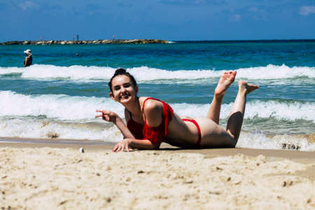 Tel Aviv Israel July 6, 2019 View of unknown teen having fun on the beach of Tel Aviv during a sunny day in the afternoonのeditorial素材