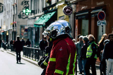 Paris France May 04, 2019 View of a French firefighters walking in the street during protests of the Yellow jackets against the policy of President Macron in Paris on saturday afternoonのeditorial素材