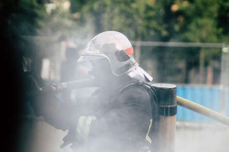 Reims France May 18, 2019 View of firefighters extinguishing a construction hut burned by rioters during protests of the Yellow Jackets in the streets of Reims on saturday afternoonのeditorial素材
