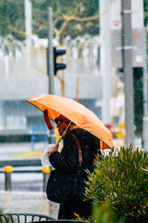 Tel Aviv Israel February 19, 2020 View of unidentified people walking in the streets of Tel Aviv during a raining day in winterのeditorial素材