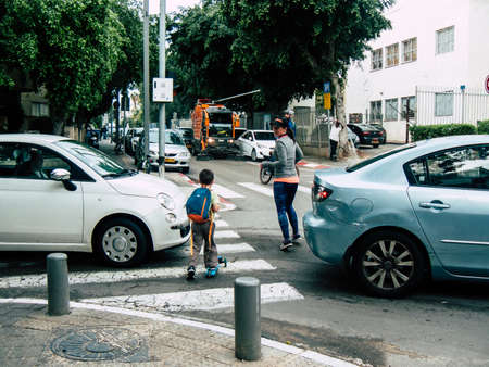Tel Aviv Israel December 12, 2018 View of unknowns Israeli people walking in the streets of Tel Aviv in the afternoonのeditorial素材