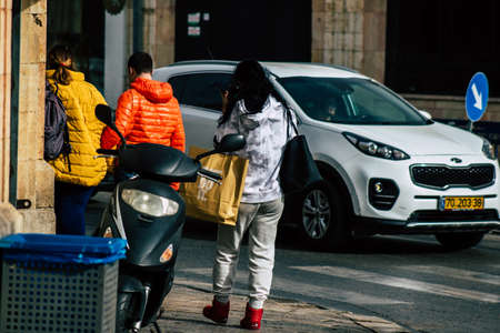 Tel Aviv Israel December 25, 2019 View of unidentified people walking in the streets of Tel Aviv in the afternoonのeditorial素材