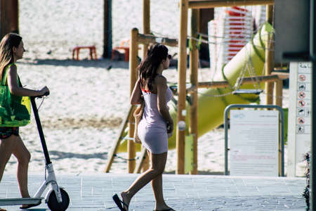 Tel Aviv Israel October 08, 2019 View of unknown Israeli woman walking in the streets of Tel Aviv in the afternoonのeditorial素材