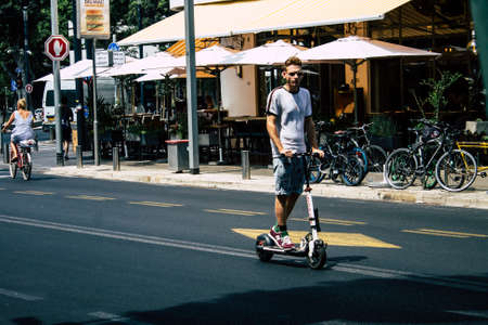 Tel Aviv Israel July 15, 2019 View of unknown Israeli people rolling with a electric scooter in the streets of Tel Aviv in the afternoonのeditorial素材