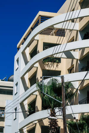 View of the facade of a modern building located on the coastal avenue right in the heart of the city of Limassol in Cyprus islandのeditorial素材