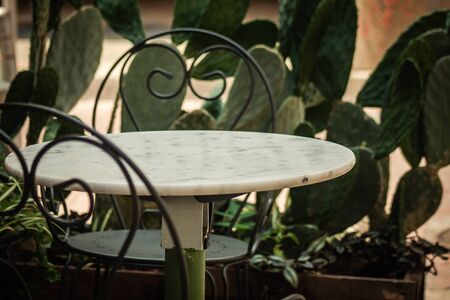 Closeup of chairs and table from a restaurant located in the old city of Limassol in Cyprus islandの写真素材