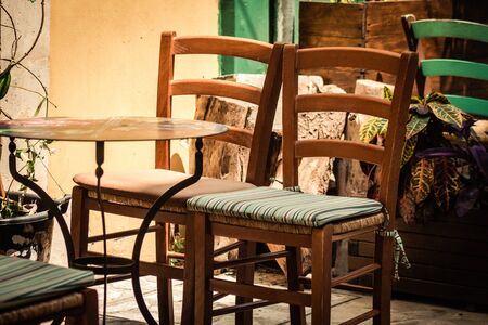 Closeup of chairs from a restaurant located in the old city of Limassol in Cyprus islandの写真素材