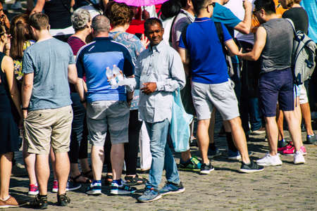 Rome Italy September 29, 2019 View of unknowns street vendor working front the Coliseum also known as the Flavian Amphitheatre in the center of the city of Romeのeditorial素材