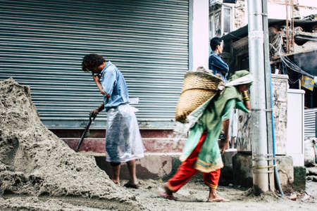 Kathmandu Nepal August 24, 2018 View of unknowns Nepali worker building a new house in Durbar street in Kathmandu in the morningの写真素材