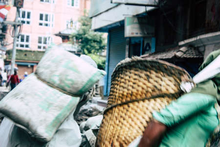 Kathmandu Nepal August 24, 2018 View of unknowns Nepali worker building a new house in Durbar street in Kathmandu in the morningの写真素材