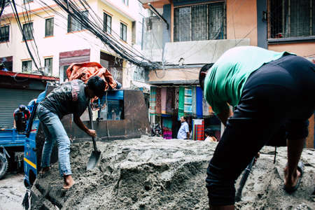 Kathmandu Nepal August 24, 2018 View of unknowns Nepali worker building a new house in Durbar street in Kathmandu in the morningの写真素材