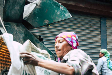Kathmandu Nepal August 24, 2018 View of unknowns Nepali worker building a new house in Durbar street in Kathmandu in the morningのeditorial素材