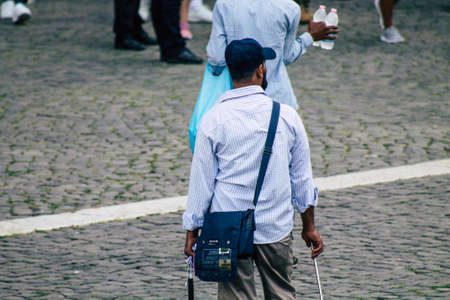 Rome Italy September 29, 2019 View of unknowns street vendor working front the Coliseum also known as the Flavian Amphitheatre in the center of the city of Romeのeditorial素材