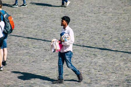 Rome Italy September 29, 2019 View of unknowns street vendor working front the Coliseum also known as the Flavian Amphitheatre in the center of the city of Romeのeditorial素材