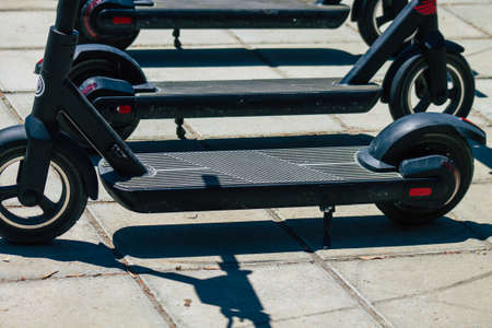 Nicosia Cyprus 04 July 2020 View of electric scooters to hire, operating with a small utility internal combustion engine and a large deck in the center  parked in the streets of Nicosia, Cyprusの写真素材