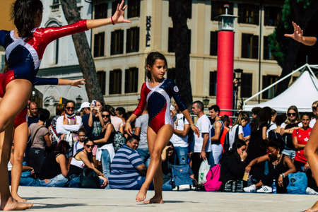 Rome Italy September 29, 2019 Celebrations of the 150th anniversary of the Italian gymnastics federation, public demonstration of young gymnasts in the streets of Rome near the Coliseumのeditorial素材